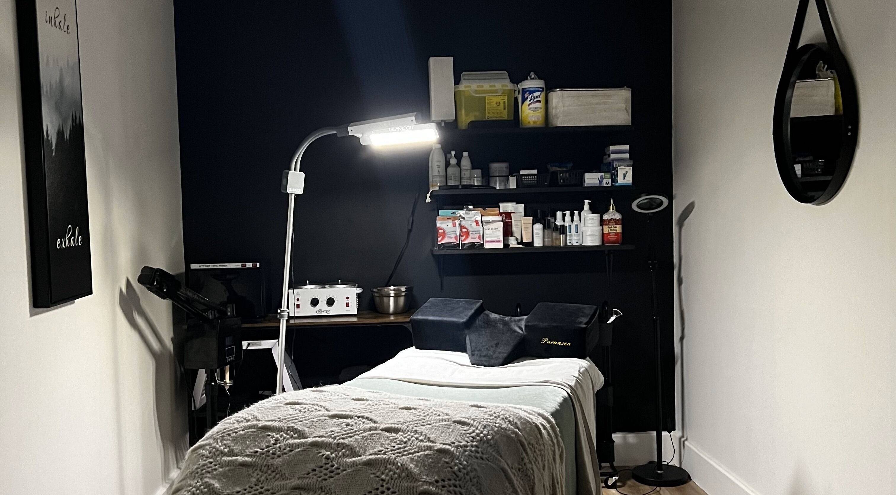 Cozy spa treatment room at The Loft Spa, Barrington Passage, Nova Scotia, CA, featuring a massage table.