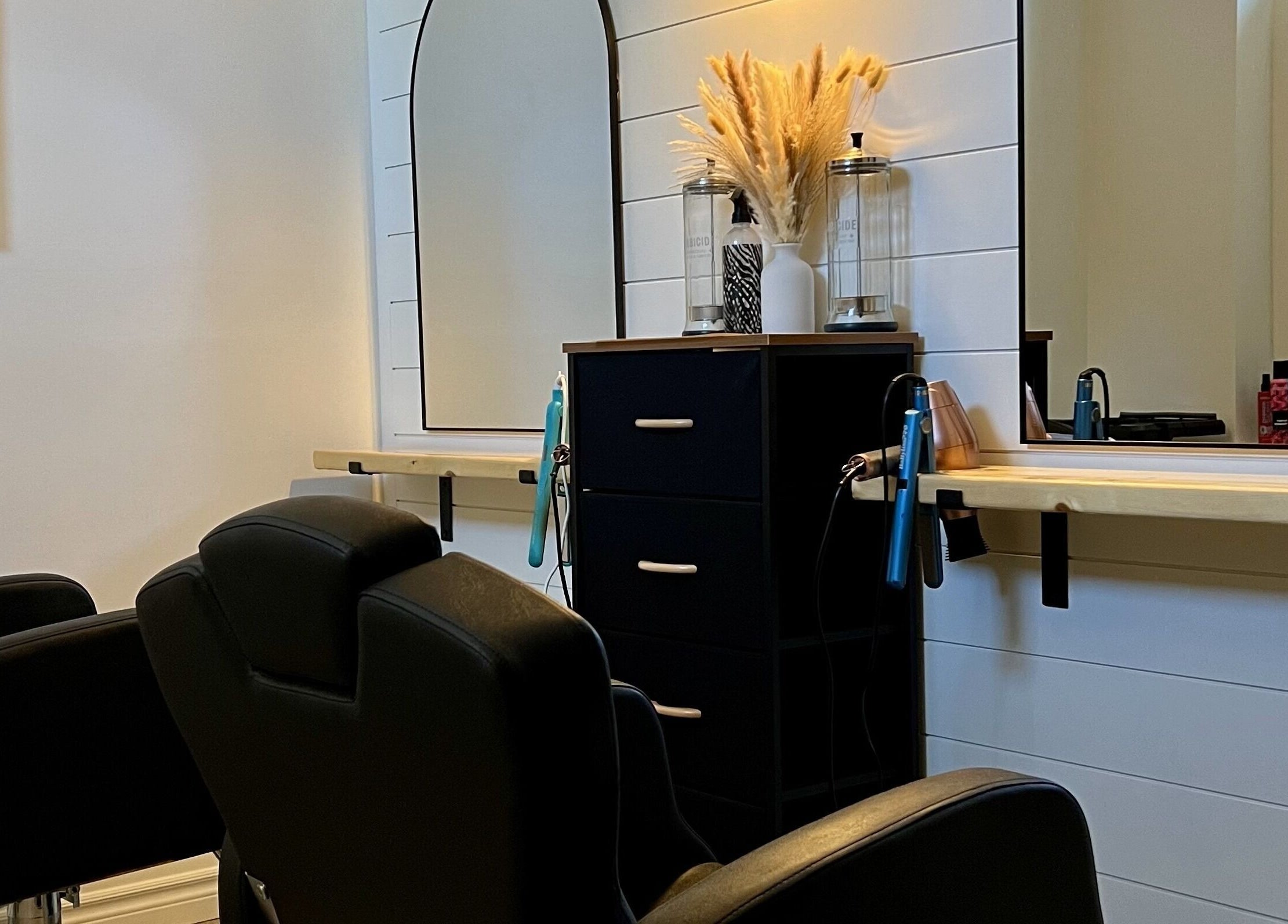 Elegant salon interior at The Loft Spa, Barrington Passage, Nova Scotia, CA with modern styling chairs and decor.