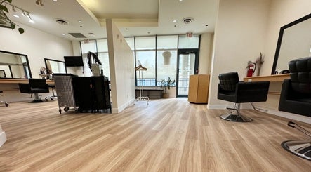 Interior of CuE Hair Salon Vancouver featuring stylish chairs and modern decor, located in Vancouver, British Columbia, CA.