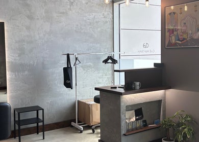 CuE Hair Salon Richmond's modern reception area in Richmond, British Columbia, CA with chic decor.