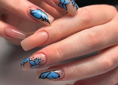 Butterfly nail art at Mimisnailbar, Barkingside, Ilford, England, GB showcases intricate blue designs.