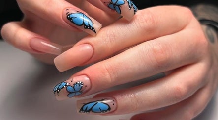 Blue butterfly nail art at Mimisnailbar, Barkingside, Ilford, England, GB offers stylish nail designs.