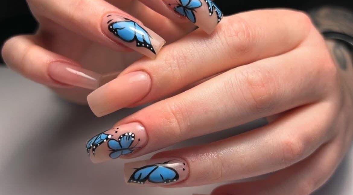 Elegant butterfly nail art from Mimisnailbar, Barkingside, Ilford, England, GB. Perfect for stylish manicures.