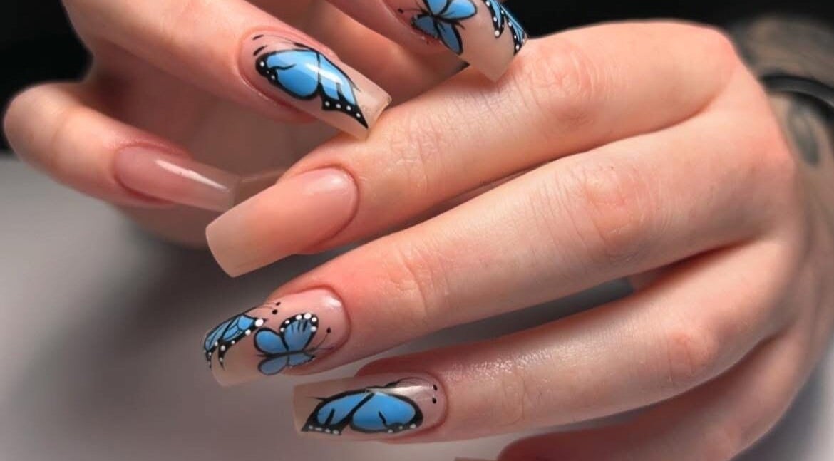 Elegant butterfly nail art from Mimisnailbar, Barkingside, Ilford, England, GB. Perfect for stylish manicures.