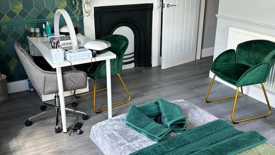 Vanity Fayre's elegant treatment room in Donington, England, GB, featuring plush chairs and a stylish nail station.