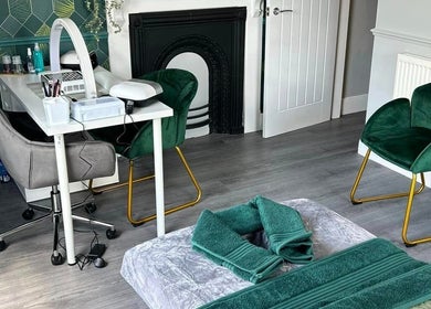 Vanity Fayre's elegant treatment room in Donington, England, GB, featuring plush chairs and a stylish nail station.