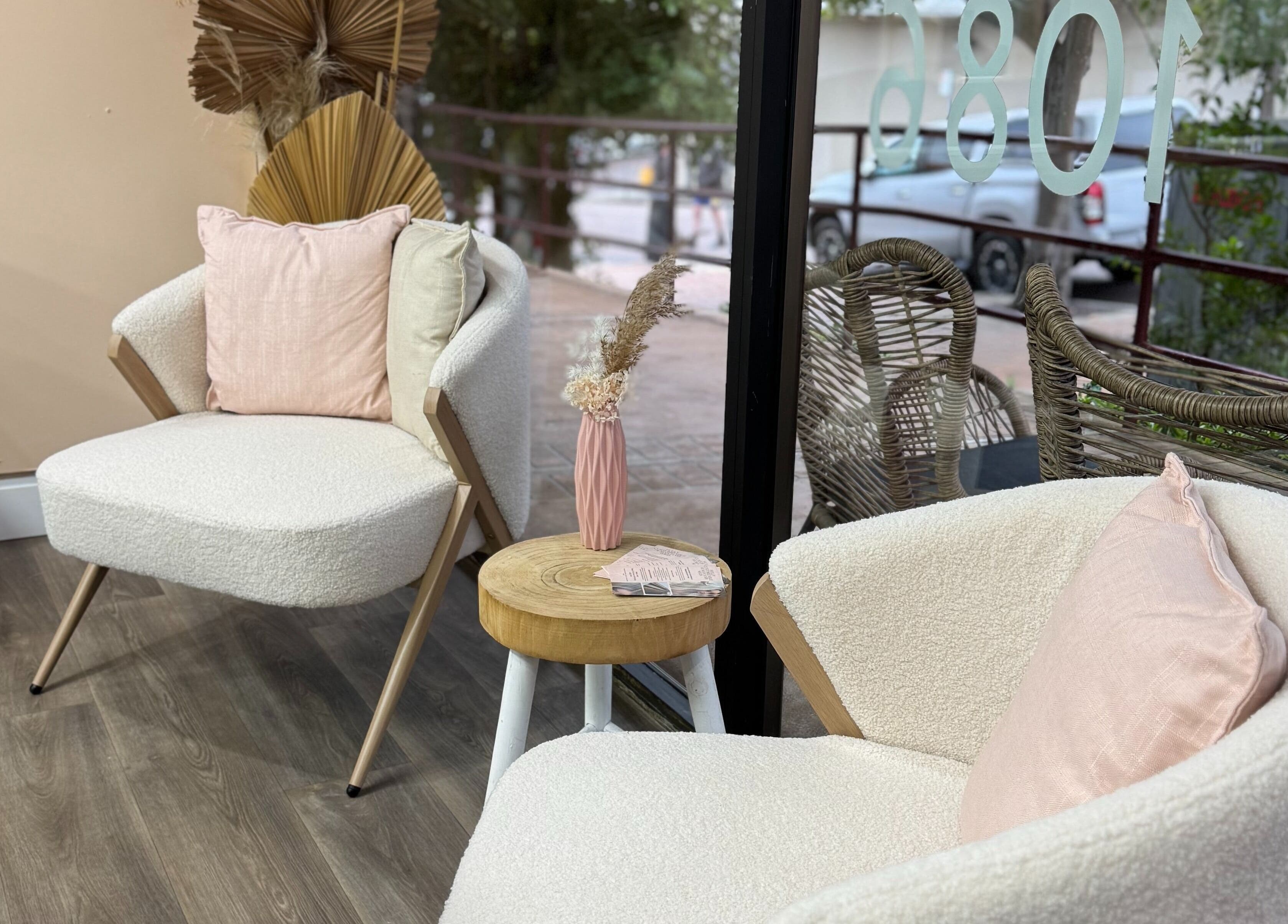 Cozy seating area in Amour Hair, Wyong, New South Wales, AU, with stylish chairs and decor.