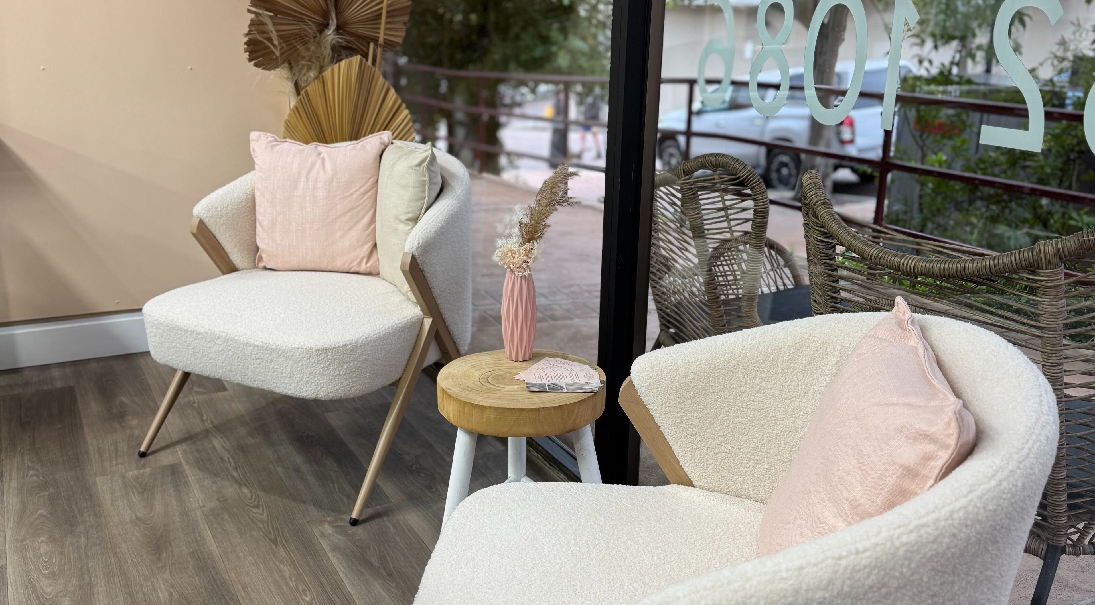 Cozy seating area in Amour Hair, Wyong, New South Wales, AU, with stylish chairs and decor.