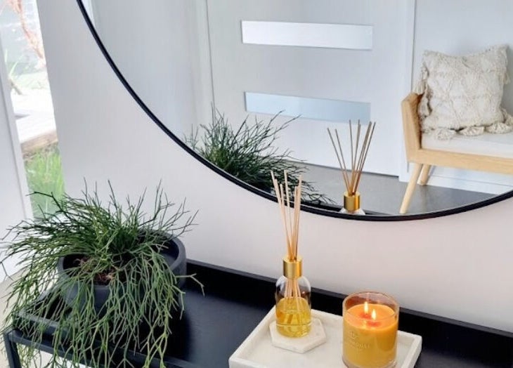 Chic Room of Beauty decor with candle and plant in Papamoa, Bay Of Plenty, NZ, exudes tranquility.