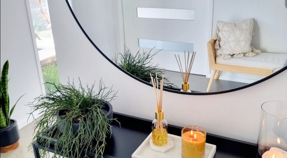 Chic Room of Beauty decor with candle and plant in Papamoa, Bay Of Plenty, NZ, exudes tranquility.