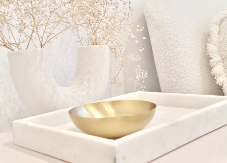 Elegant decor at Room of Beauty, Papamoa, Bay Of Plenty, NZ featuring a gold bowl and dried flowers.