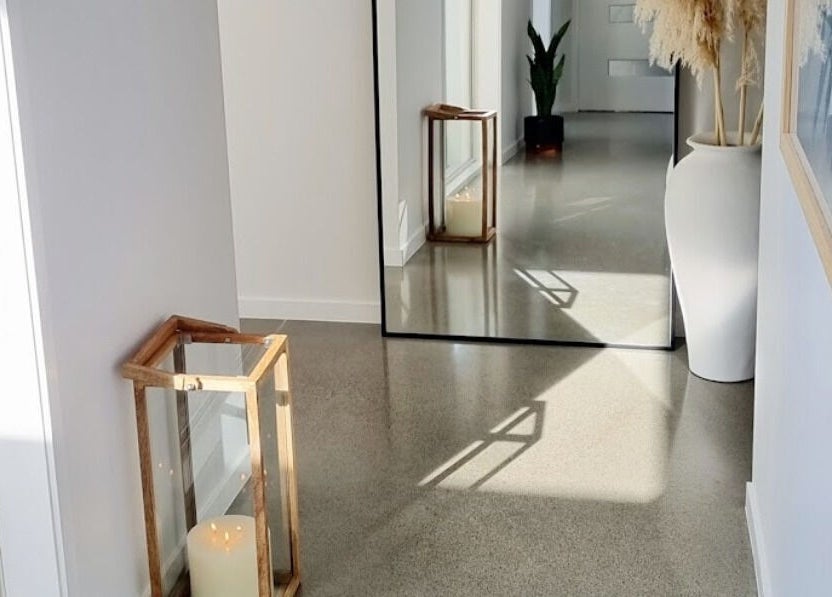 Inviting hallway with mirror and candle at Room of Beauty, Papamoa, Bay Of Plenty, NZ.