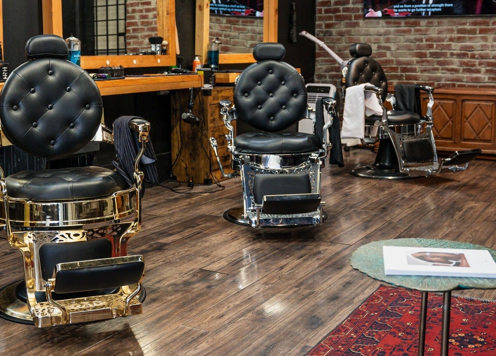 Elegant barber chairs at HEstory Barbershop in Vancouver, British Columbia, CA showcase a classic style.