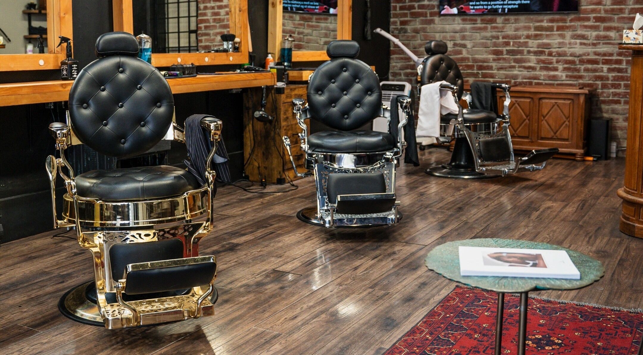 Elegant barber chairs at HEstory Barbershop in Vancouver, British Columbia, CA showcase a classic style.