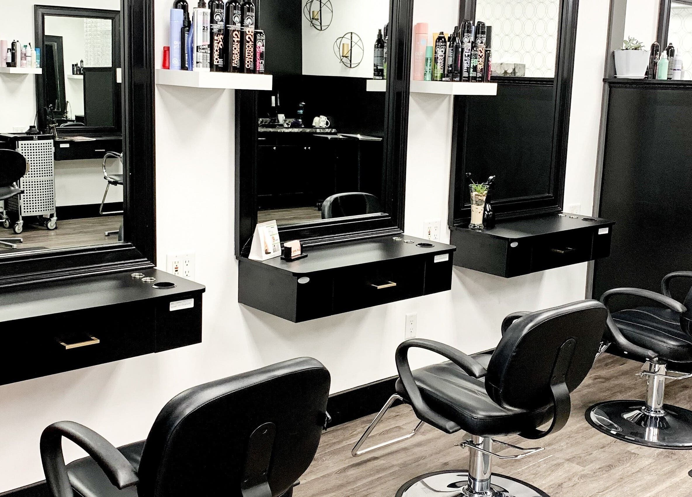 Elegant salon setup at Contagious Studio, Abbotsford, British Columbia, CA with modern styling stations.