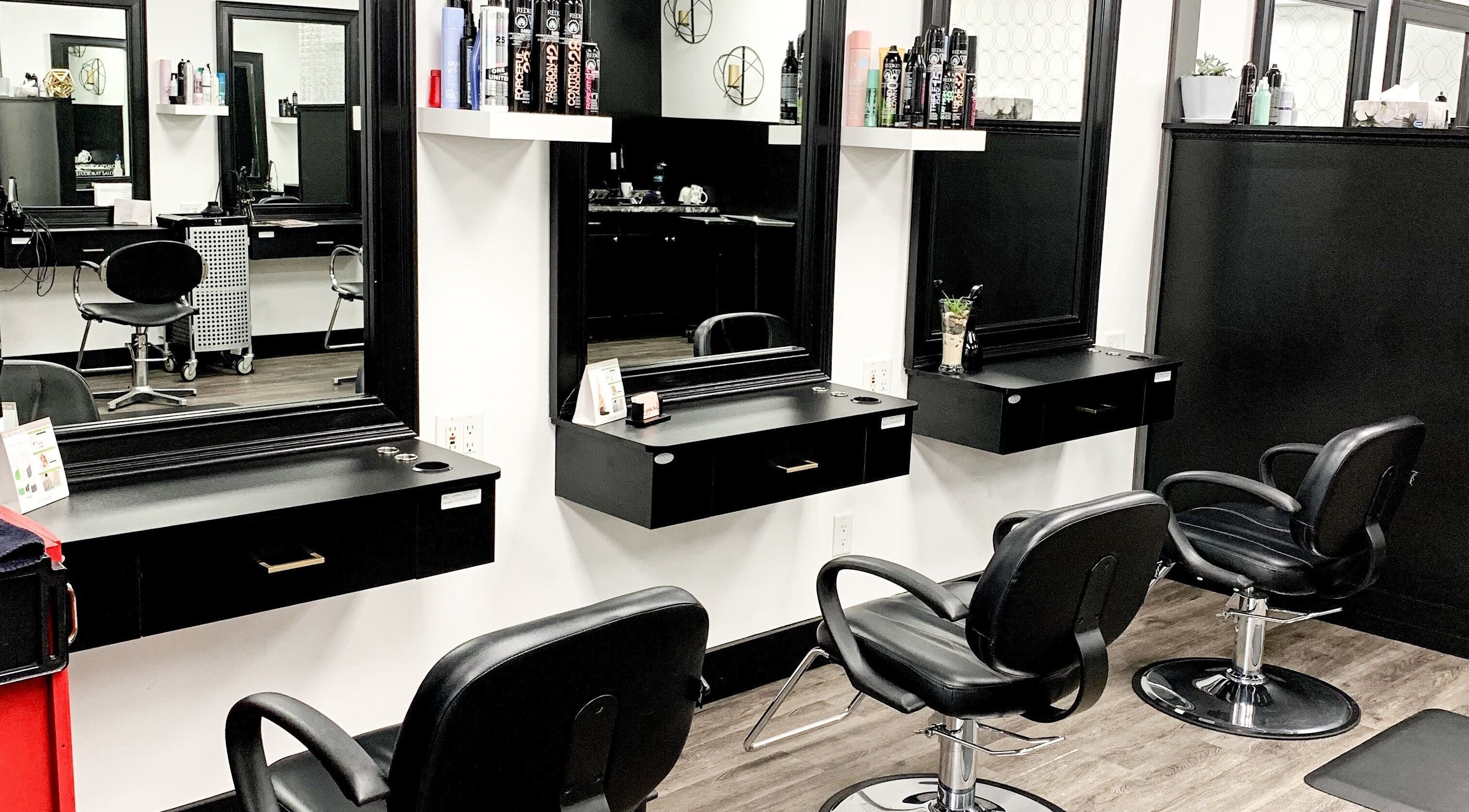 Elegant salon setup at Contagious Studio, Abbotsford, British Columbia, CA with modern styling stations.