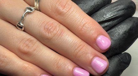Close-up of glittery pink nails at Sophie Victoria Nails, Frome, England, GB.
