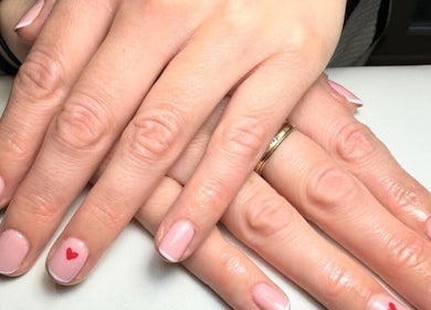 Stylish pink manicure with heart detail at Sophie Victoria Nails, Frome, England, GB.