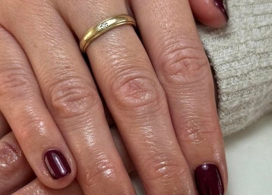 Sophisticated nails with maroon polish at Sophie Victoria Nails, Frome, England, GB.
