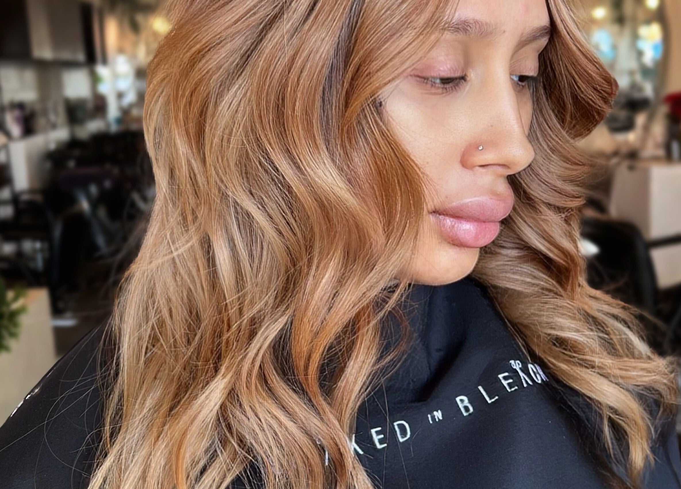 Styled By Elicia salon showing golden wavy hair in West Covina, California, US.