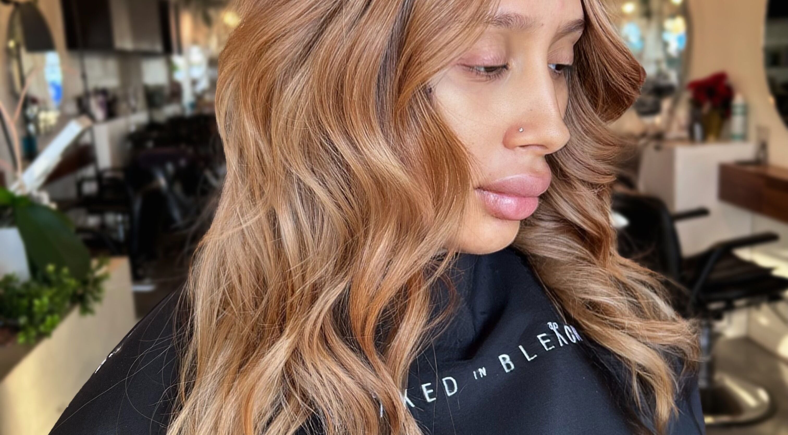 Styled By Elicia salon showing golden wavy hair in West Covina, California, US.
