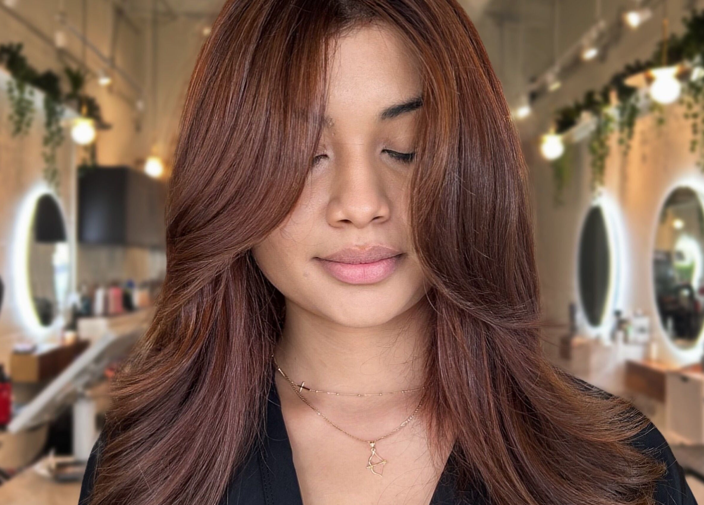 Woman with styled brown hair at Styled By Elicia in West Covina, California, US.
