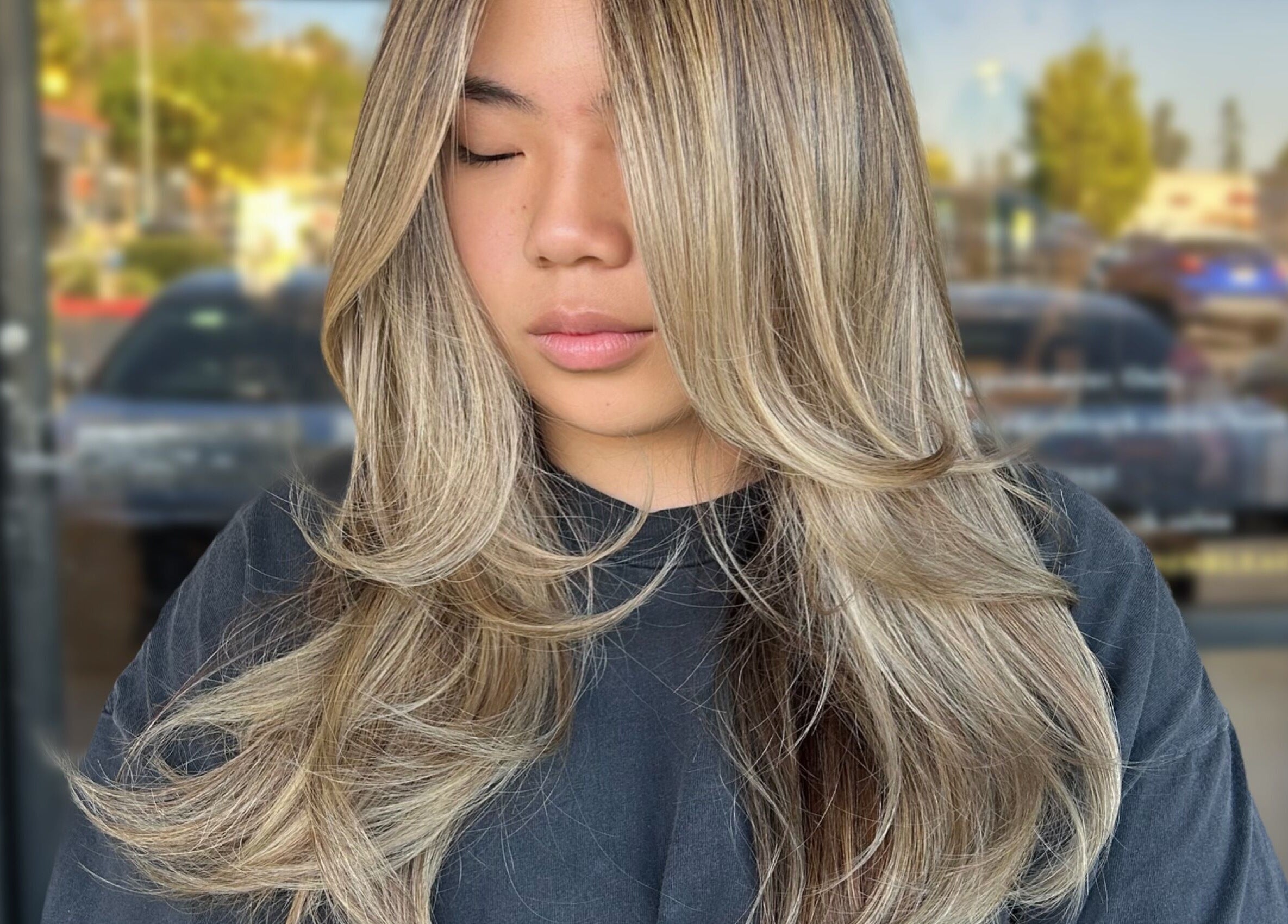 Blonde hair with soft waves styled at Styled By Elicia, West Covina, California, US.