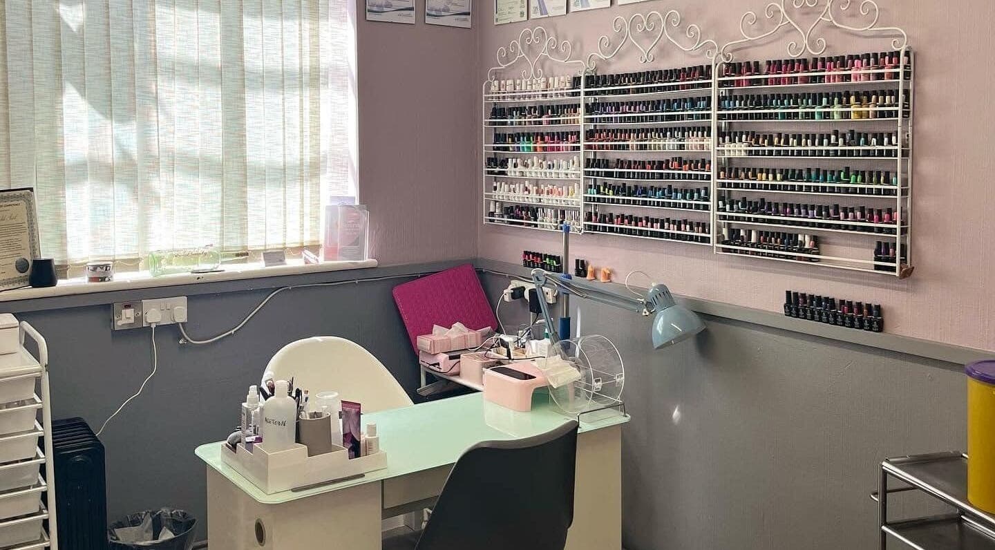 Serenity Nails and Beauty's elegant nail station in Warmley, England, GB, displays colorful polish selections.