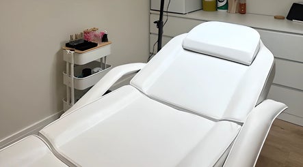Comfortable treatment bed at Moriah Aesthetics, Bournemouth, England, GB, offering a tranquil wellness experience.