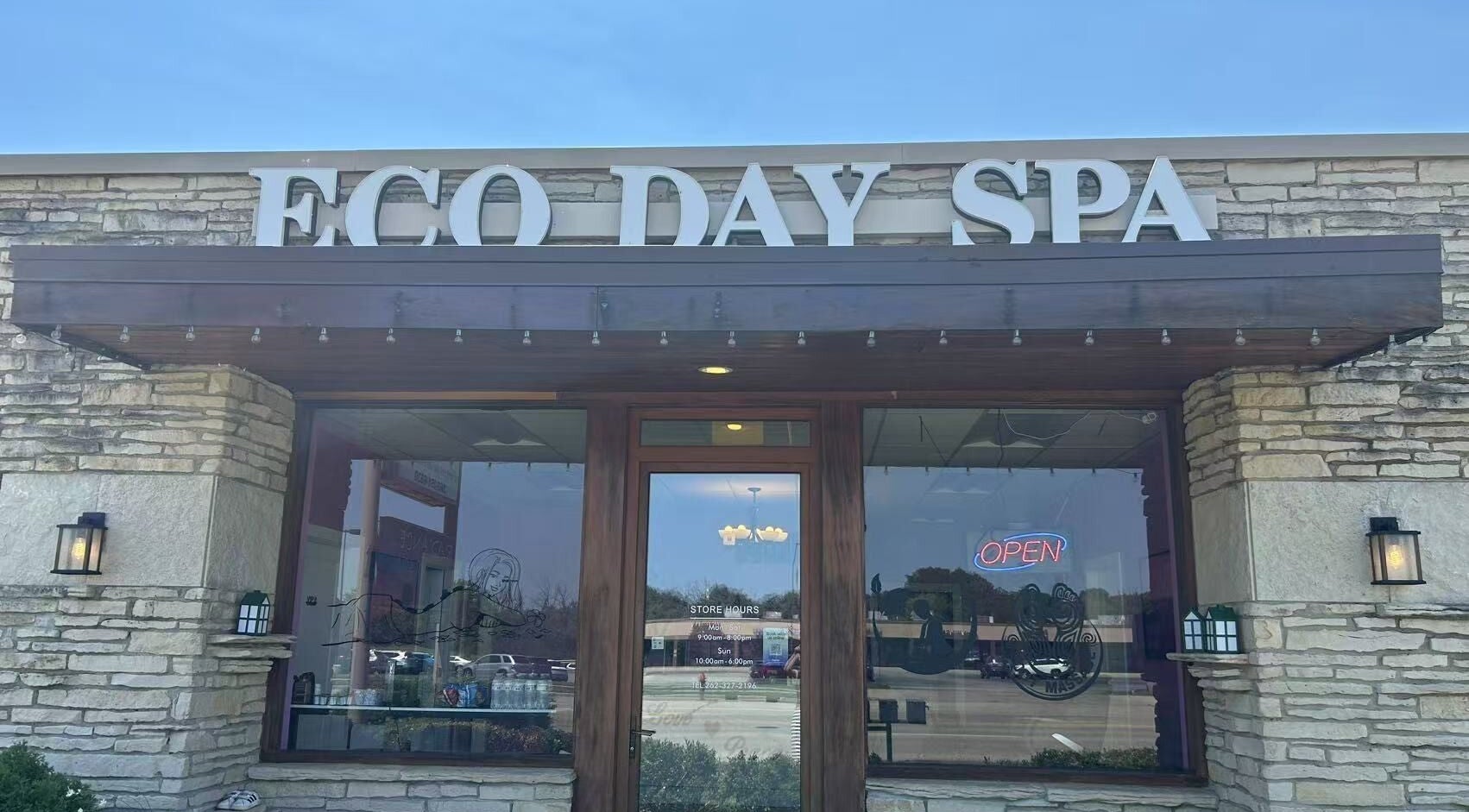 Front view of ECO Day Spa in Menomonee Falls, Wisconsin, US, showcasing its inviting stone facade.