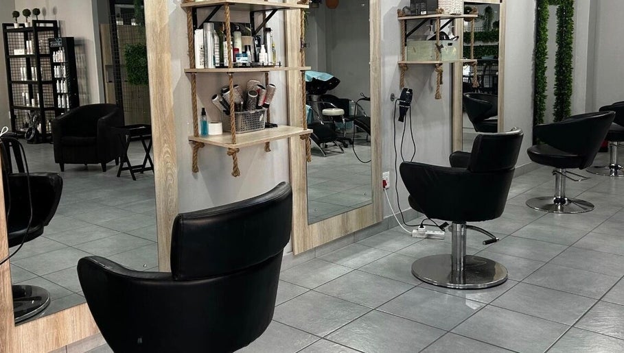 Modern salon interior at Hair by Sharon @ Boksburg, Gauteng, ZA with sleek styling chairs and mirrors.