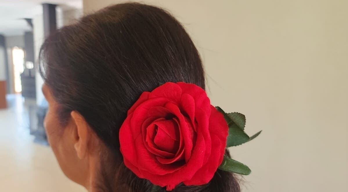 Elegant hairstyle with red rose at Hair by Sharon @ Envy, Boksburg, Gauteng, ZA.
