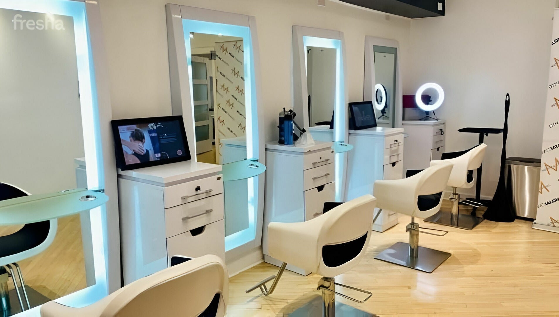 Elegant salon stations at Dynamic Salon Spa Studios in Chicago, Illinois, US with modern seating and mirrors.