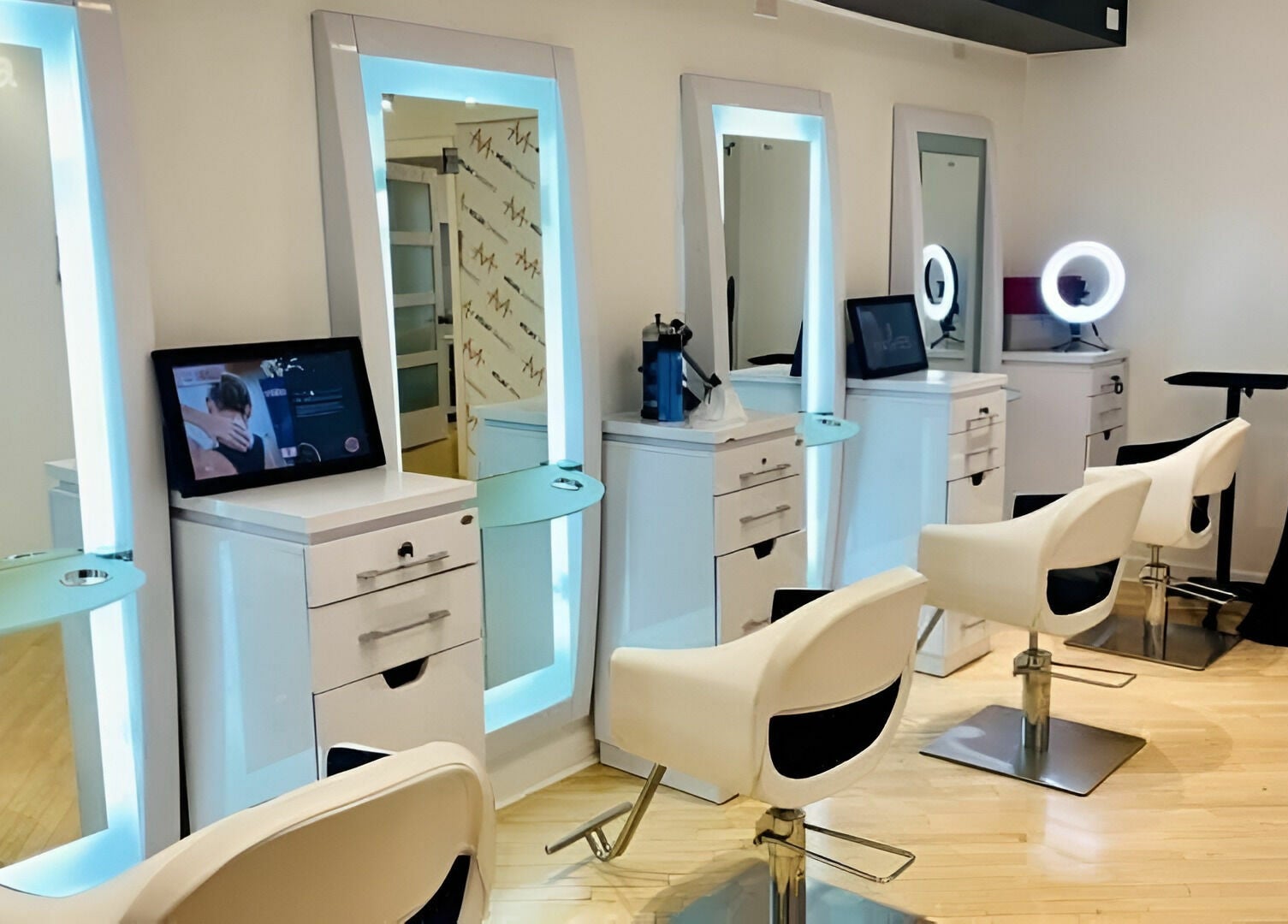 Elegant salon stations at Dynamic Salon Spa Studios in Chicago, Illinois, US with modern seating and mirrors.