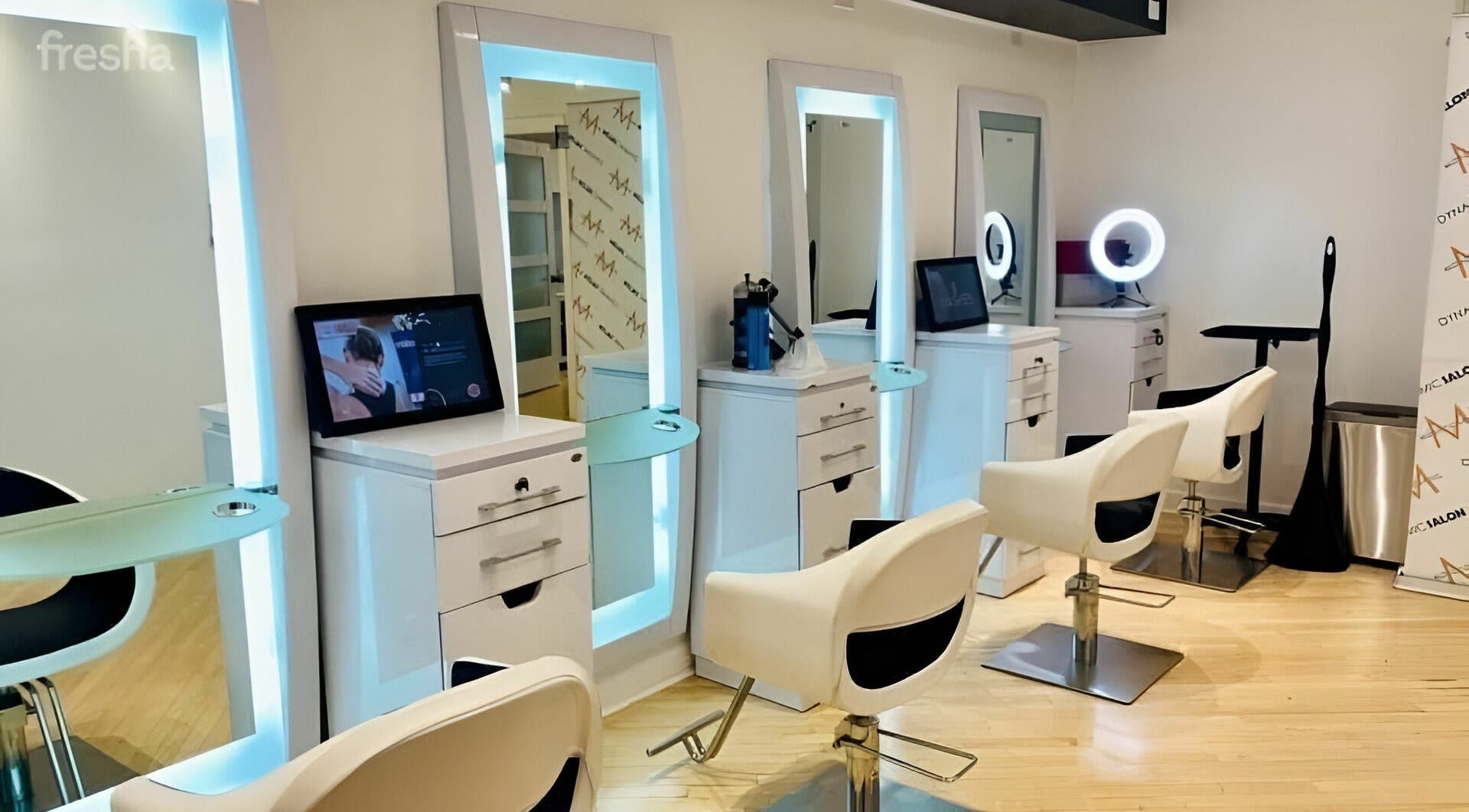 Elegant salon stations at Dynamic Salon Spa Studios in Chicago, Illinois, US with modern seating and mirrors.