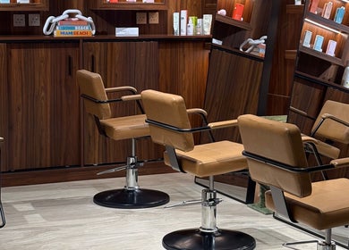Luxurious salon styling chairs at The Beauty Loft Hair Salon and Spa in Jeddah, SA, offering a premium experience.