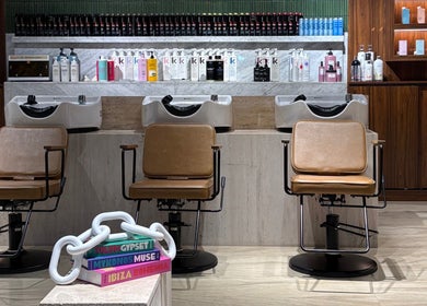 Chic wash stations at The Beauty Loft Hair Salon and Spa, Jeddah, SA, highlighting luxury hair care products.