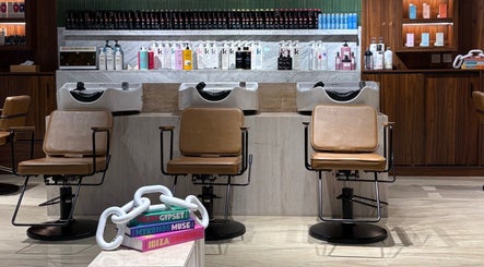 Chic wash stations at The Beauty Loft Hair Salon and Spa, Jeddah, SA, highlighting luxury hair care products.