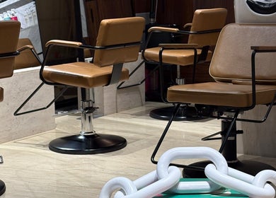 Modern salon chairs at The Beauty Loft Hair Salon and Spa, Jeddah, SA, showcasing luxury and comfort.