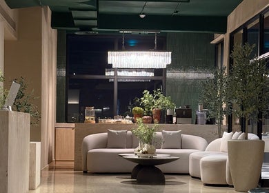 Chic lounge area at The Beauty Loft Hair Salon and Spa in Jeddah, SA, with elegant seating and decor.