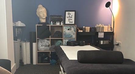 Tranquil massage room at The Recovery Room, Suton, England, GB, with calming decor and treatment table.