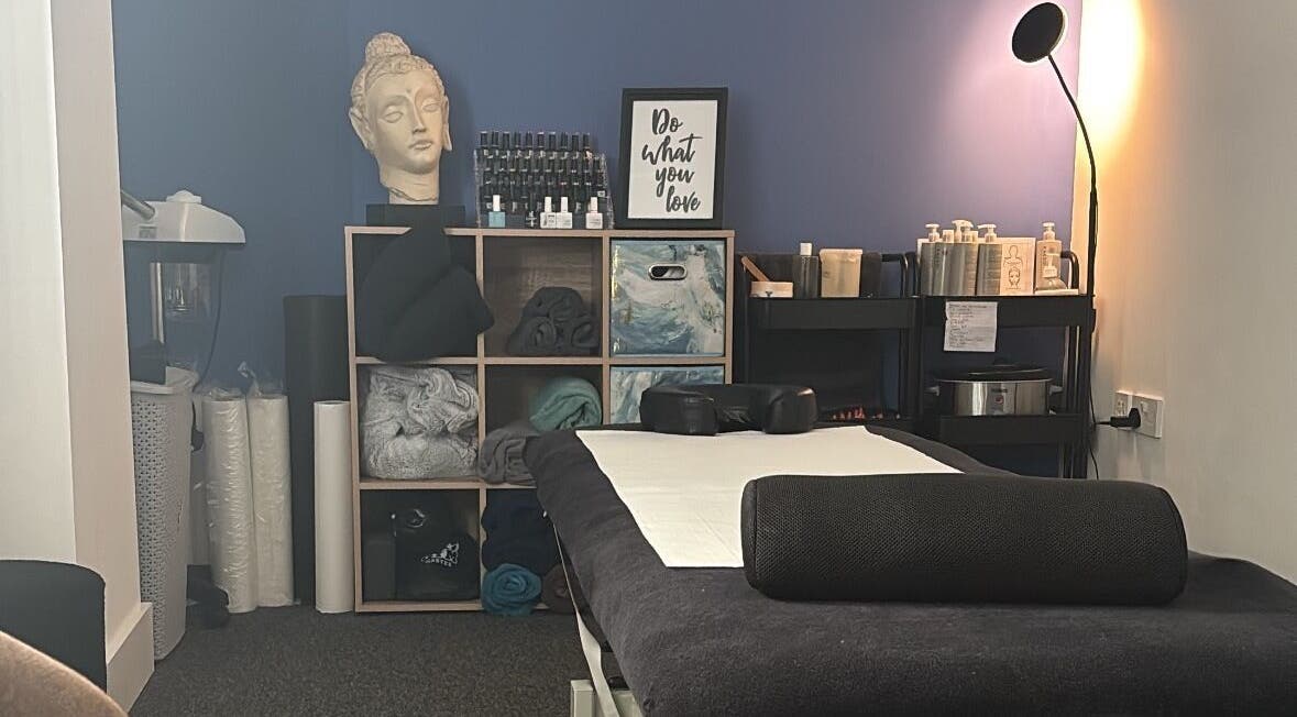 Cozy massage room at The Recovery Room, Suton, England, GB with a serene ambiance and essential oils.