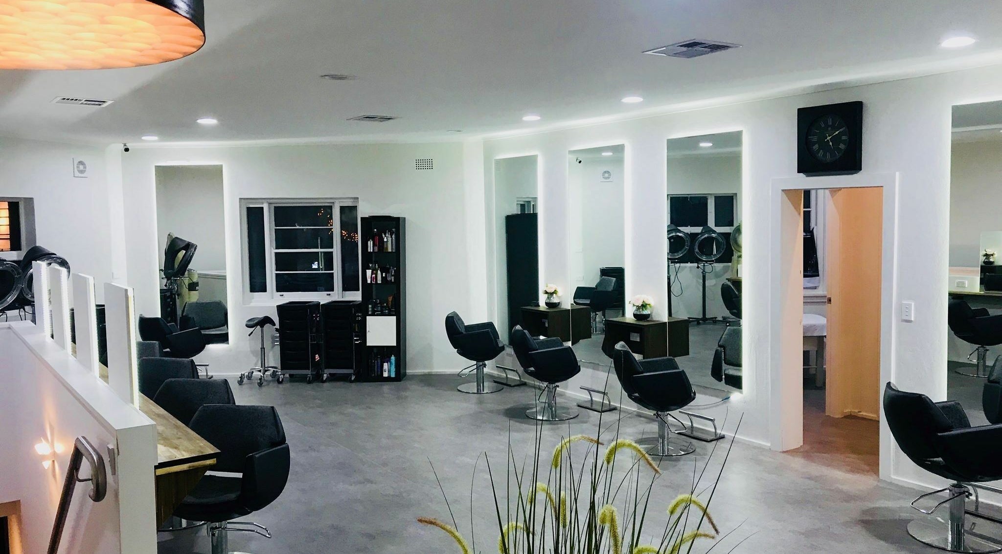 Spacious interior of Catwalk Hair Salon, Gladesville, New South Wales, AU, featuring sleek styling stations and modern decor.