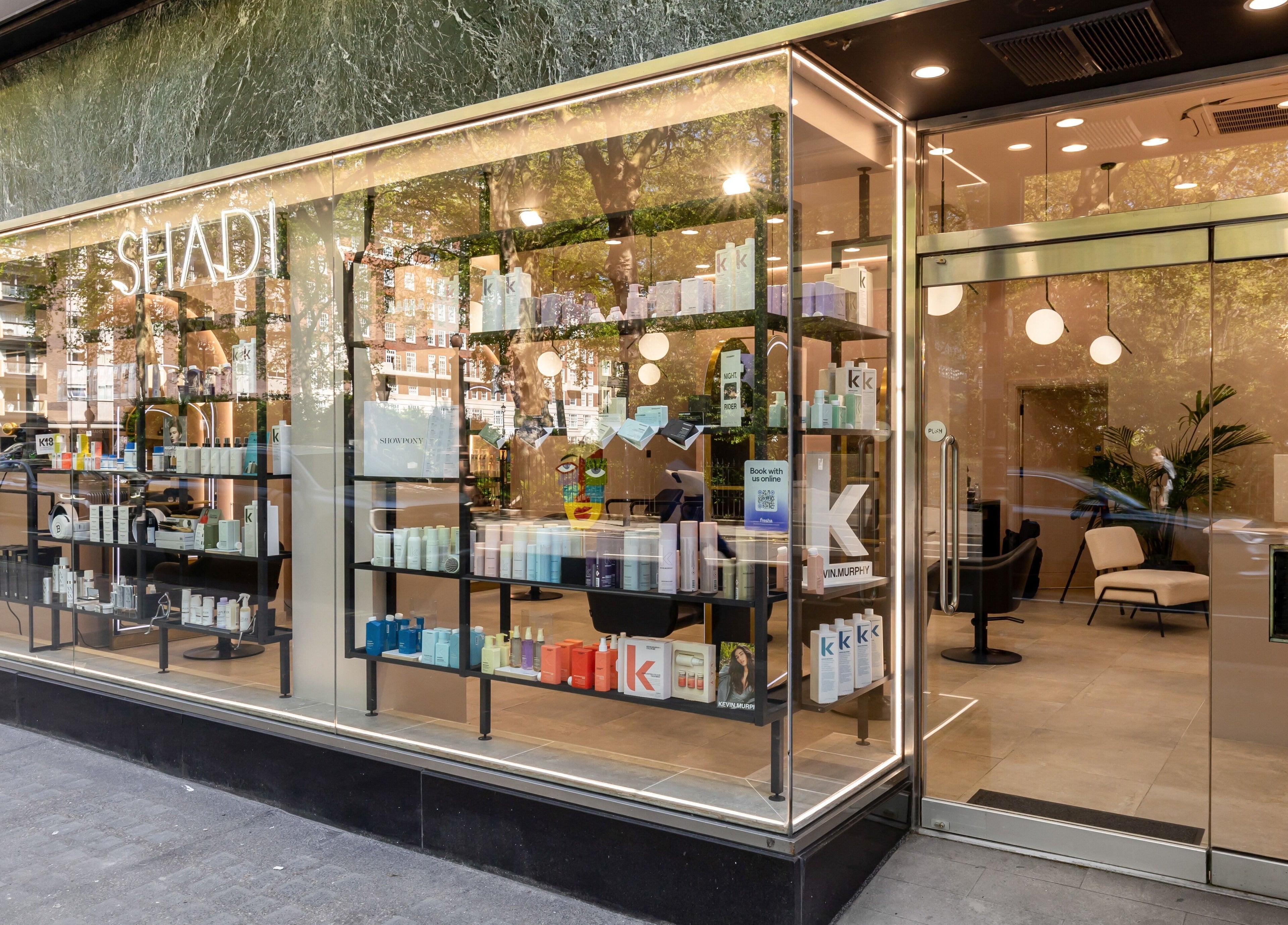 Exterior view of Shadi, a beauty and wellness venue in London, England, GB featuring sleek glass windows.