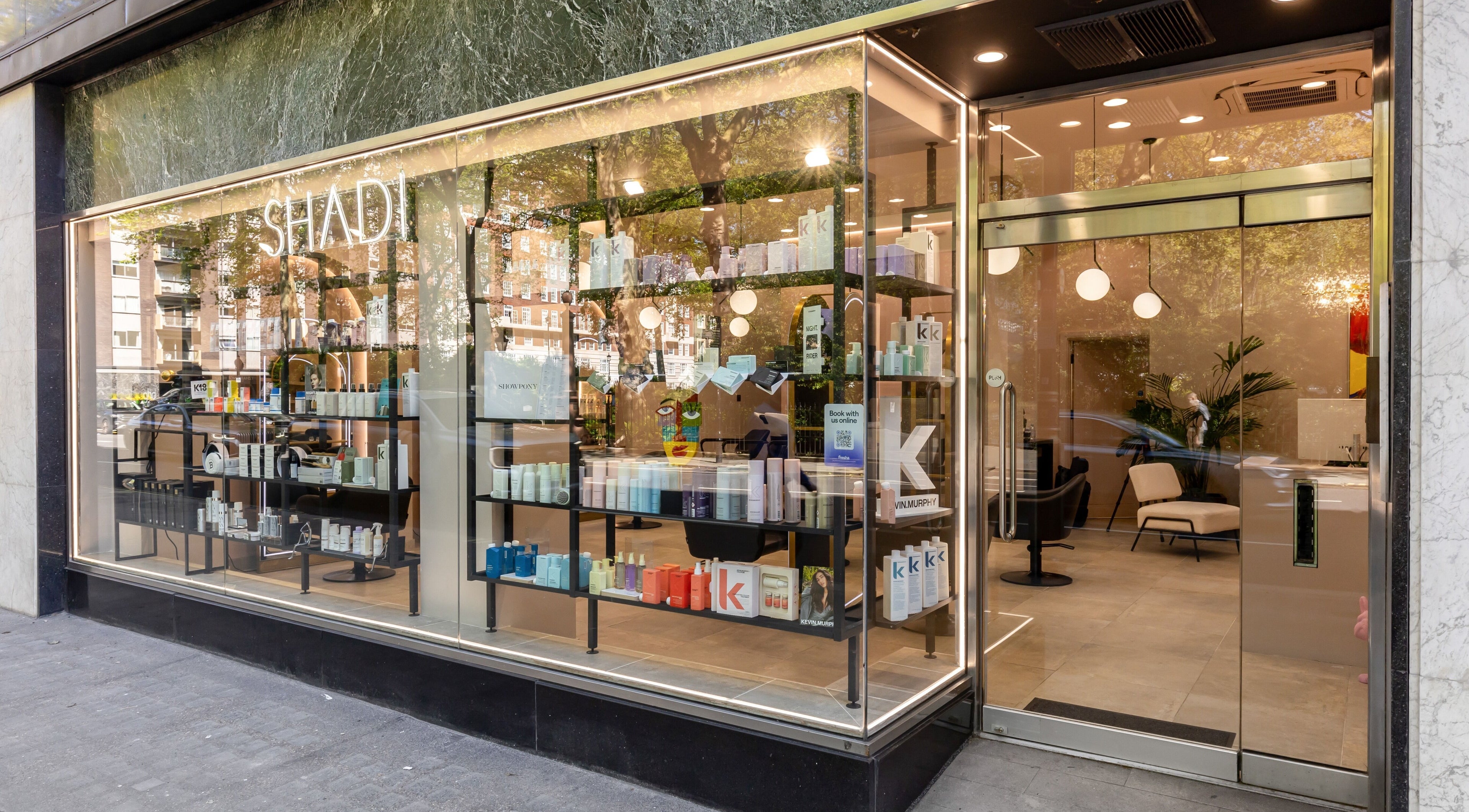 Exterior view of Shadi, a beauty and wellness venue in London, England, GB featuring sleek glass windows.