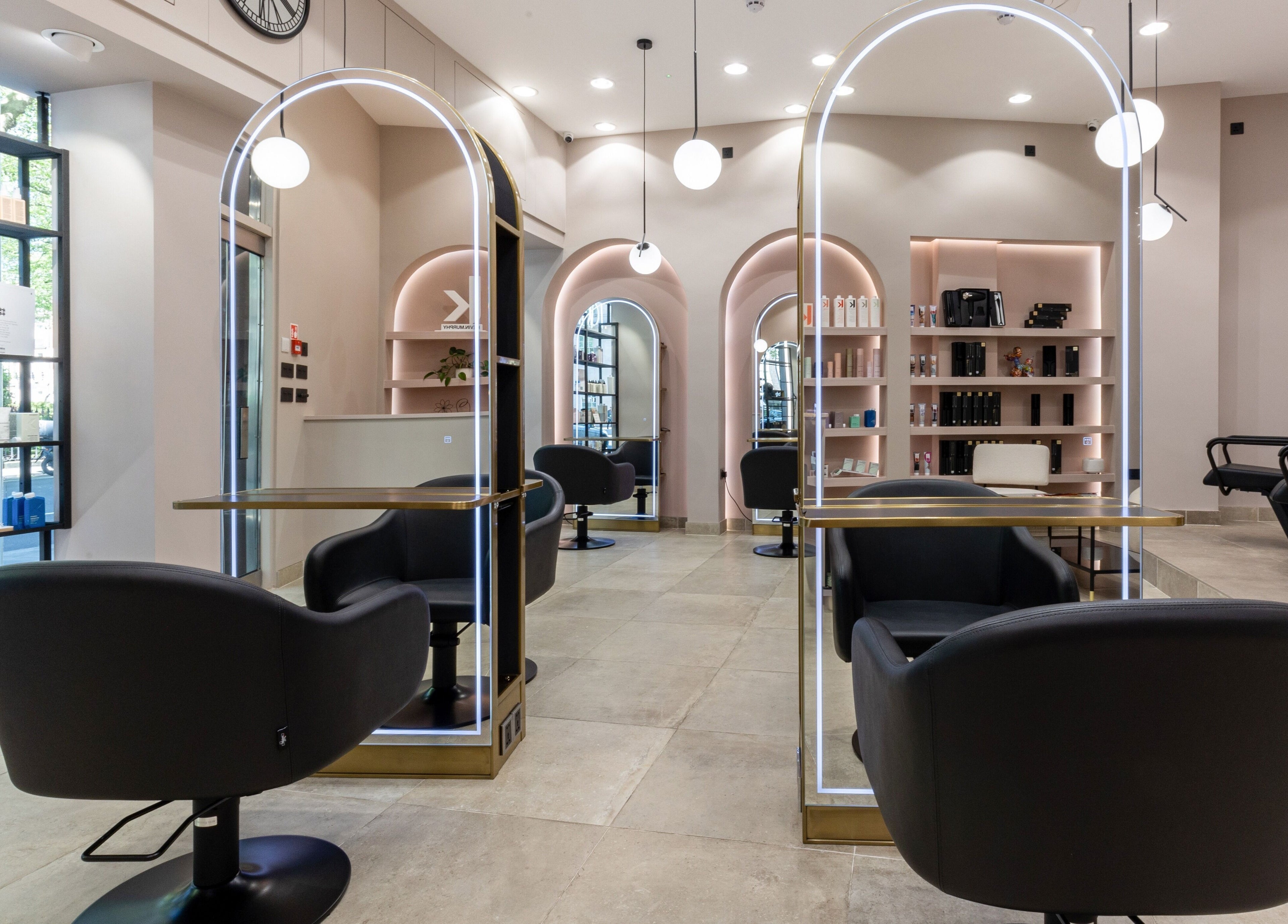 Modern salon at Shadi in London, England, GB with sleek styling chairs and ambient lighting.