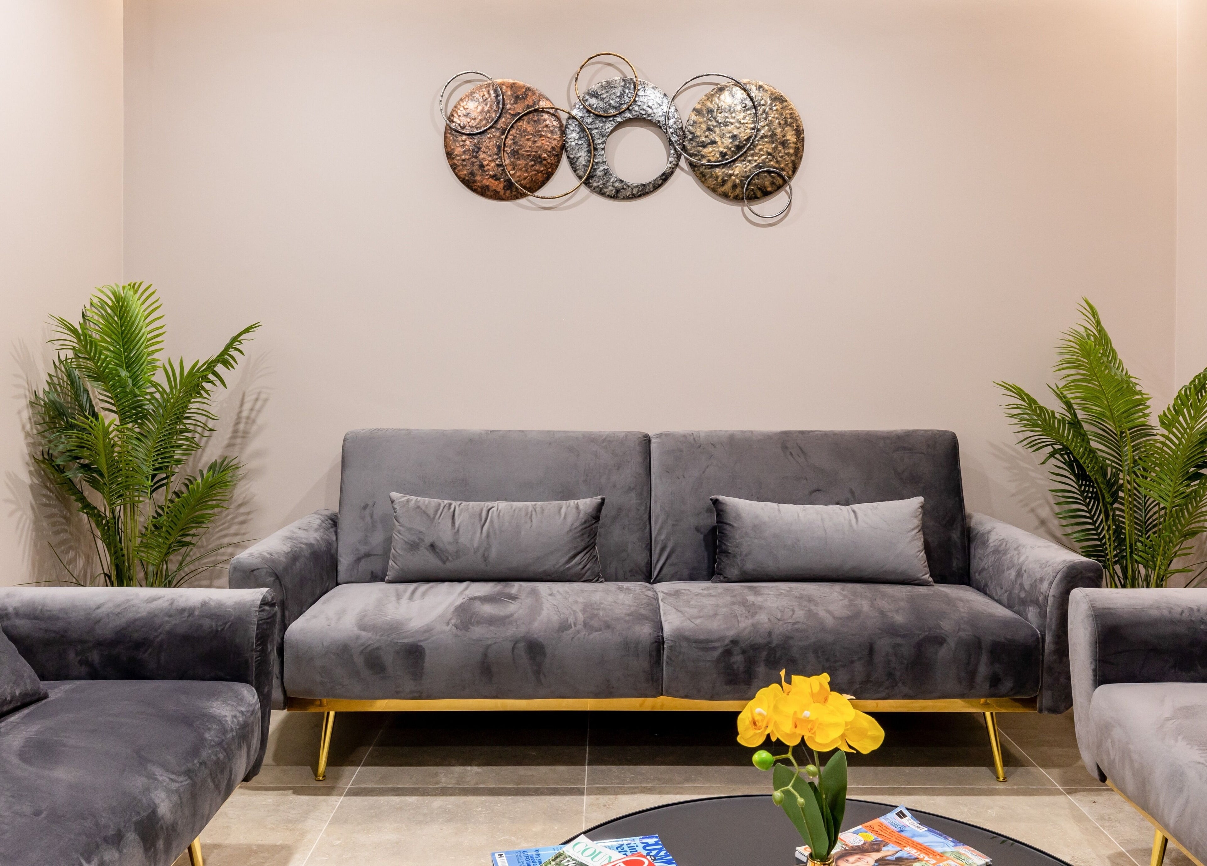 Elegant lounge at Shadi in London, England, GB with grey sofas and modern decor for relaxation.