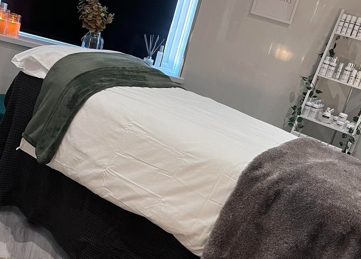 Relaxing treatment room at Beauty and Skincare by Orla in Dunmurry, Northern Ireland, GB with cozy decor.