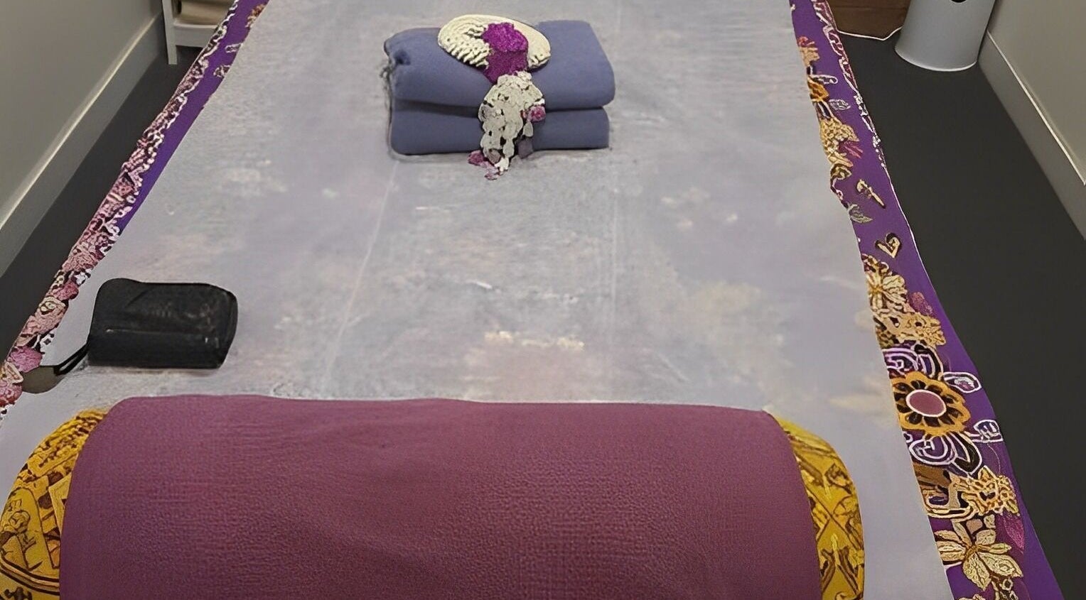 Elegant massage setup at Sriri Thai Massage in Melbourne, Victoria, AU with decorative elements on the massage bed.