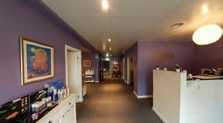 Welcoming interior of Sriri Thai Massage in Melbourne, Victoria, AU with calming purple walls and elegant decor.